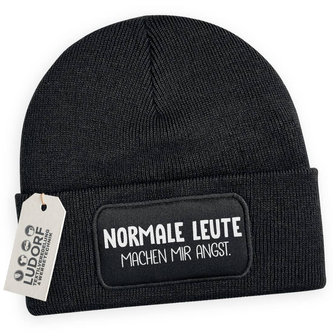 Schwarze Wintermütze mit Spruch ‚Normale Leute machen mir Angst‘